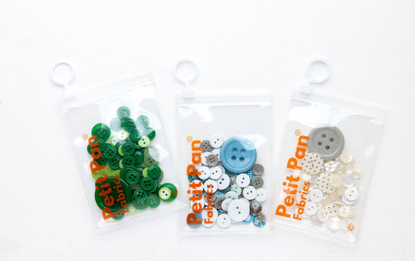 Assorted white treasure buttons